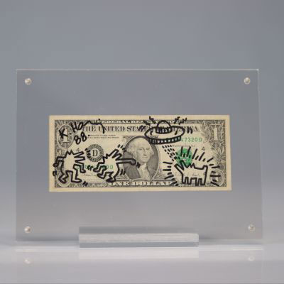 Keith HARING (1958-1990) ONE DOLLAR, 1987 Dessin au marker noir signé et daté sur un billet de banque d’un dollar