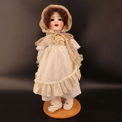 Open mouth porcelain head doll