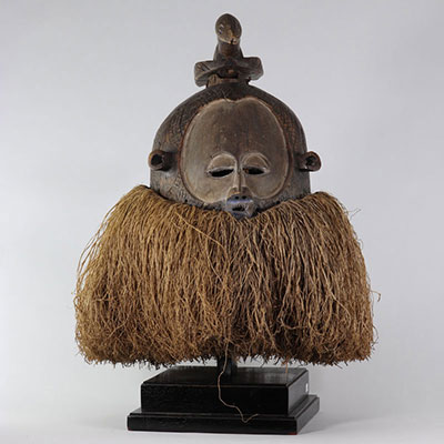 Large Suku Nemba mask Representation of a human face surmounted by an animal