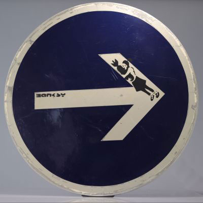 BANKSY (in the style of) - Bomb Hugger Spray paint & stencil on metal road sign - Signed 