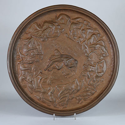 Cast and chiseled brass tray decorated with entwined human body 