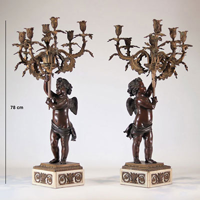 Pair of large bronze candelabras with two patina angels holding candleholders in the Louis XV style