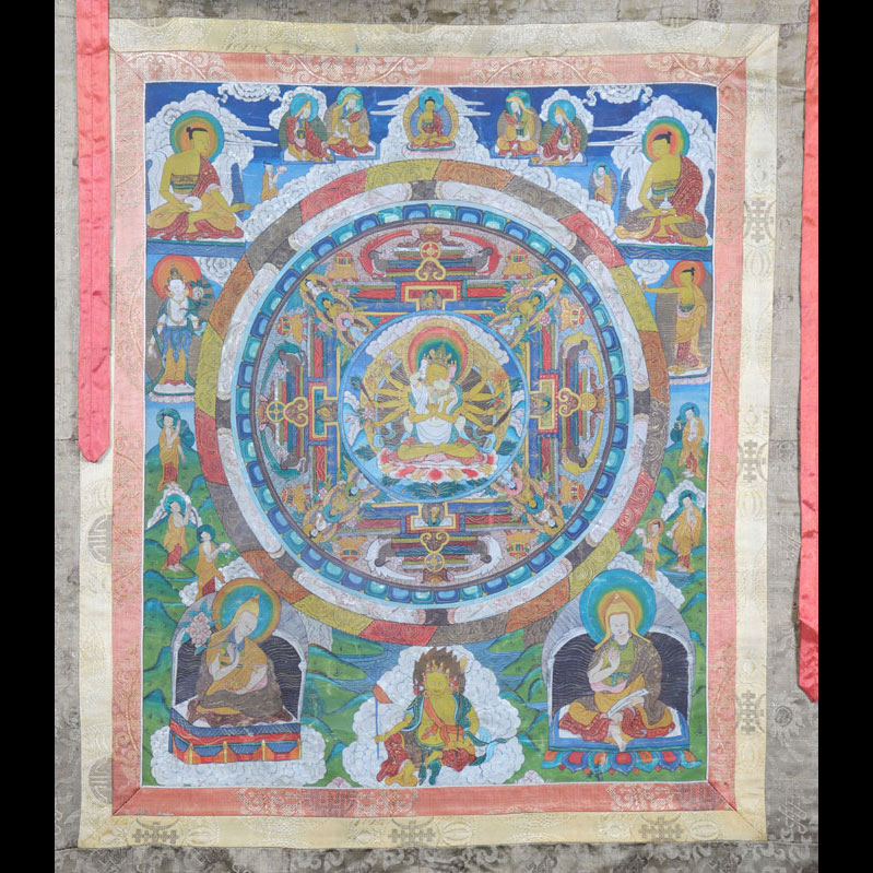 Tanka framed in golden silk with various deities, Tibet, 18th century