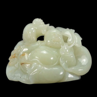Light green and rust jade carved with a Buddha