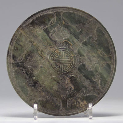 Jade disc with archaic decoration 
