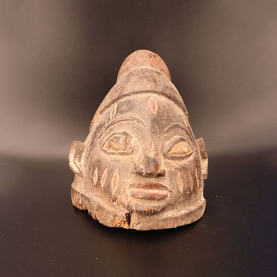 Wooden Yoruba mask with white pigment trace