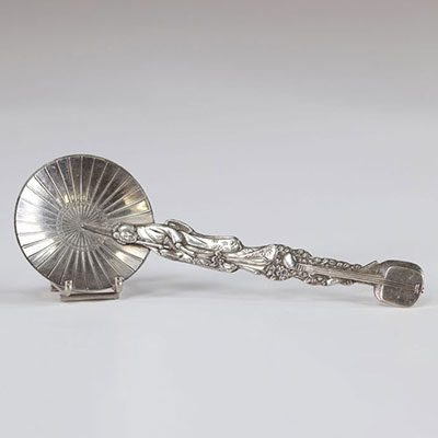 Silver spoon representing a geisha with an umbrella
