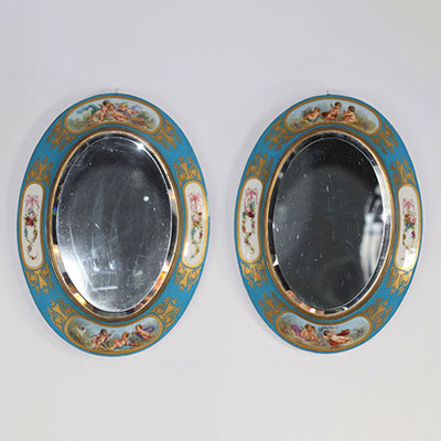 Sèvre Exceptional pair of porcelain mirrors decorated with scenes of flowers and cherubs