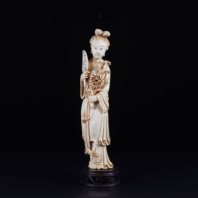 China large ivory sculpture of a young woman holding a flower and a fan circa 1900