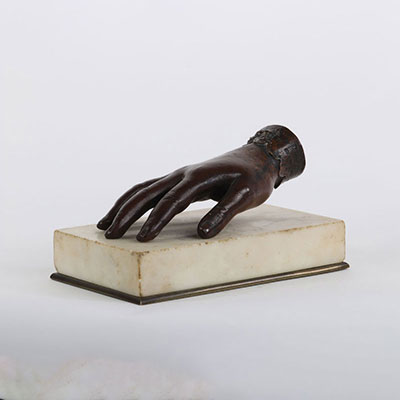 Bronze paperweight topped with a woman's hand 19th