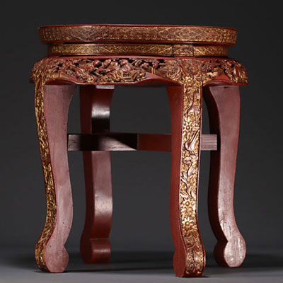 China - Small red and gold lacquer side table with carved figures and floral motifs, late 19th century.e.