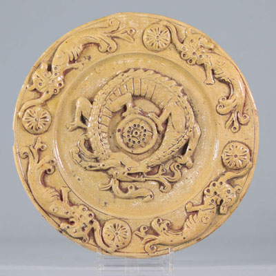 Glazed earthenware dish decorated with Asian dragons