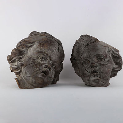 Putti heads in carved wood, Baroque period (accidents and losses)