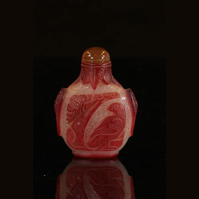 China - Piriform snuff bottle in red overlay glass on bubbled bottom, with bird decoration