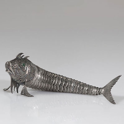 Articulated fish with stone-encrusted eyes