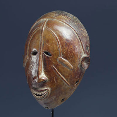 Ibo mask. Nigeria, wood with light brown patina