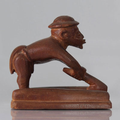 Carved Congo sculpture of a settler