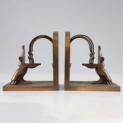 In the style of Edgar BRANDT (1880-1960) Pair of wrought iron pelican bookends.