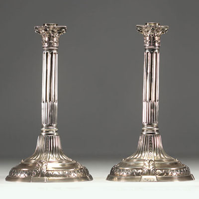 A pair of solid silver candlesticks with column decoration, hallmarked Tournai, Belgium, 18th century.