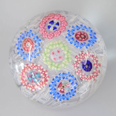 Baccarat 20th century paperweight with 7 circles on a serrated background