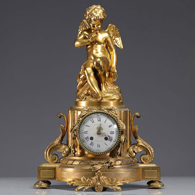 Pendule en bronze doré surmonté d'un ange XIXème