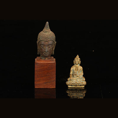 Tête de bouddha et bouddha en bronze