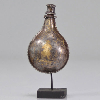 Powder flask probably Germany 16th century in iron engraved with characters in gold