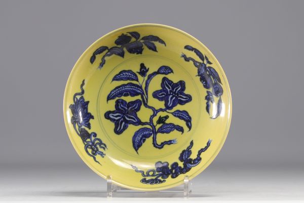 China - Porcelain dish decorated with flowers in white and blue on a yellow background, blue mark.