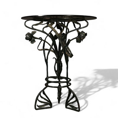Table en verre à piétement floral en fer forgé d'époque Art Nouveau.