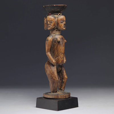 Sculpture, figure with 4 heads