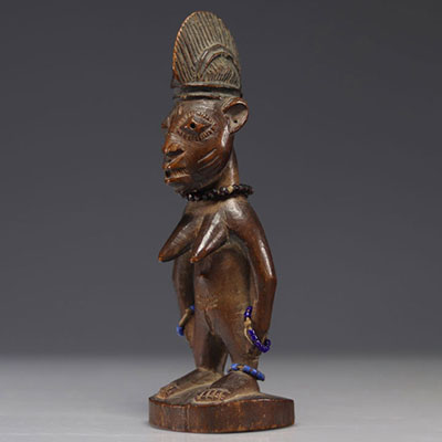 Ibedji Yoruba female statuette adorned with pearl jewelry