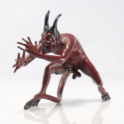 Bergman Bronze of Vienna with red lacquer representing an erect devil. Austria, late 19th century.