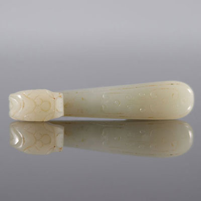 White jade fibula carved with a dragon's head and a Qing dynasty qilong