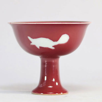 Red porcelain bowl on foot decorated with fish