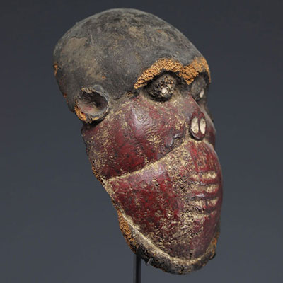 Monkey mask from Cameroon, wood and red polychromy