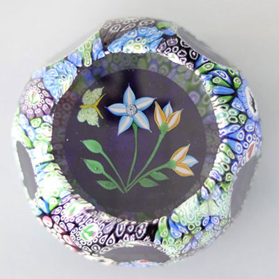 John Deacons paperweight 2003, overlay with canes on black cushion, 3 flowers and 1 butterfly