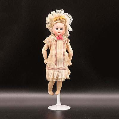 Closed mouth porcelain head doll