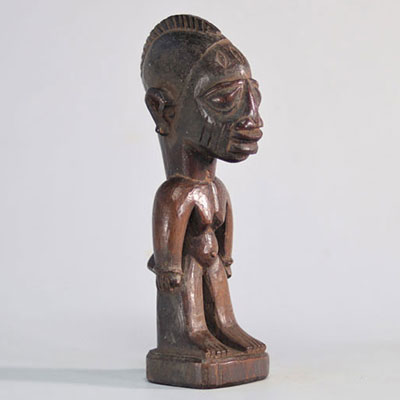 Ibeji yoruba female statue with brown patina