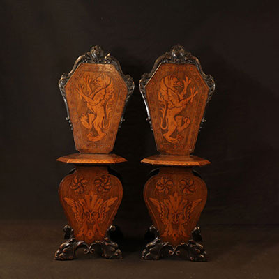 Pair of wooden chairs with Italian Renaissance Griffon inlays