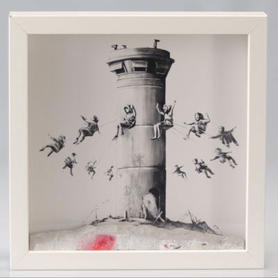 BANKSY - Box Set, 2017 Composition of a monochrome print on paper and a piece of graffitied concrete, framed under glass. Limited edition, numbered on the back. Sold