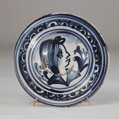 Delft? plate decorated with a woman's head probably 17th