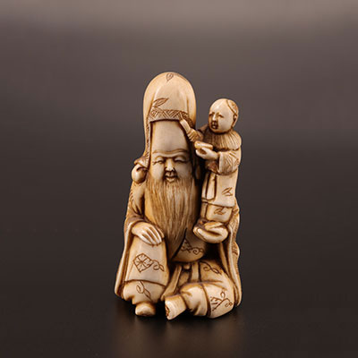 Japon -  Okimono en ivoire sculpté représentant un sage et enfant Epoque MEIJI (1868-1912)