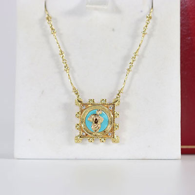 Salvador Dali Madonna de Port Lligat Necklace in yellow gold (750 thousandths), turquoise stone and diamonds. Signed on the back"Dali"